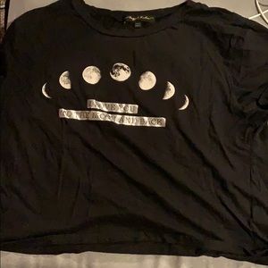 Black crop top with “I love you and back” on it